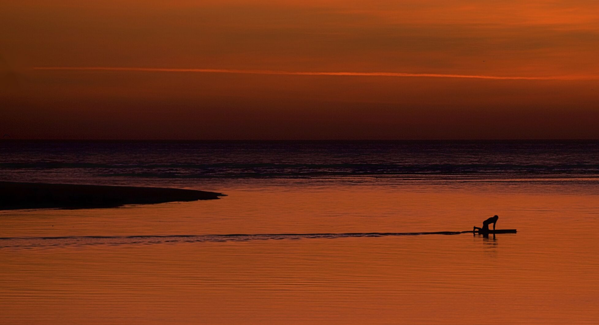 Paddleboarder heading out early from Breach Inlet
